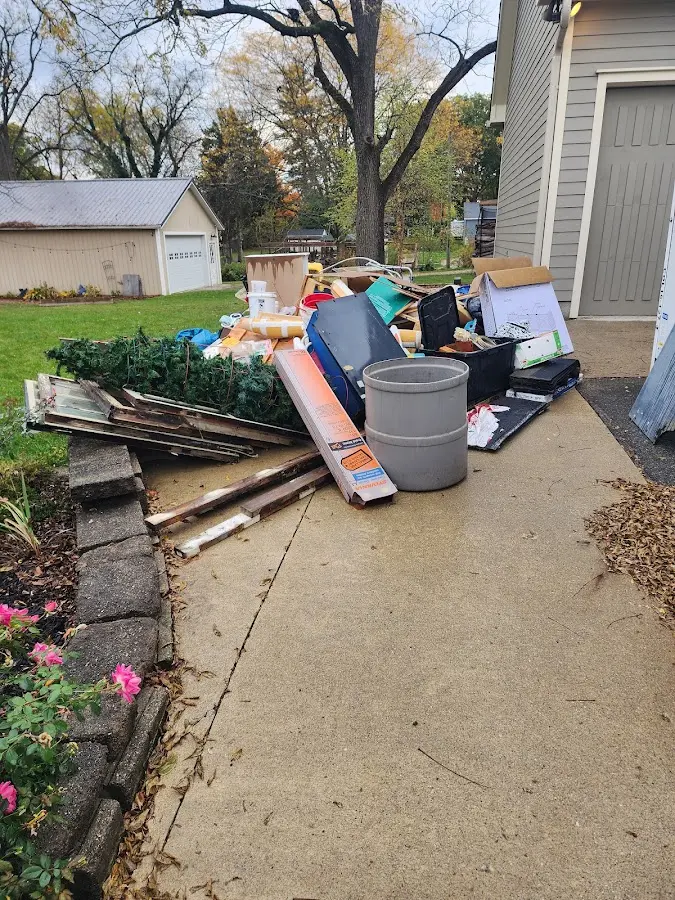 Dumpster being loaded with debris for 30 Yard Dumpster Rental in Lakeville